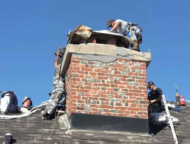 Gastonia Chimney Sweep installing a custom chimney crown in Gastonia, NC