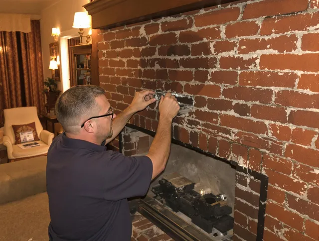 Gastonia Chimney Sweep expert fixing a fireplace in Gastonia, NC